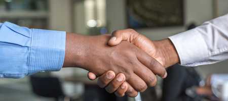 A handshake between two people.